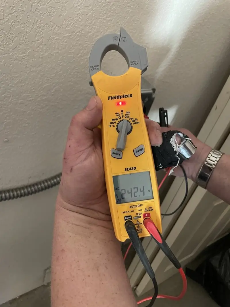 Voltage testing with clamp meter during Electrical Installation Services in Pismo Beach